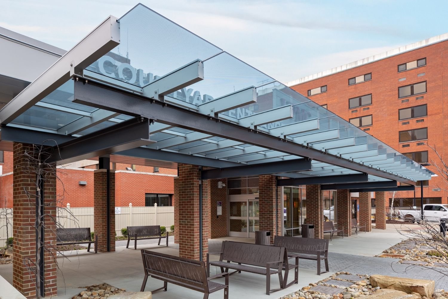 A glass canopy on a hospital patio